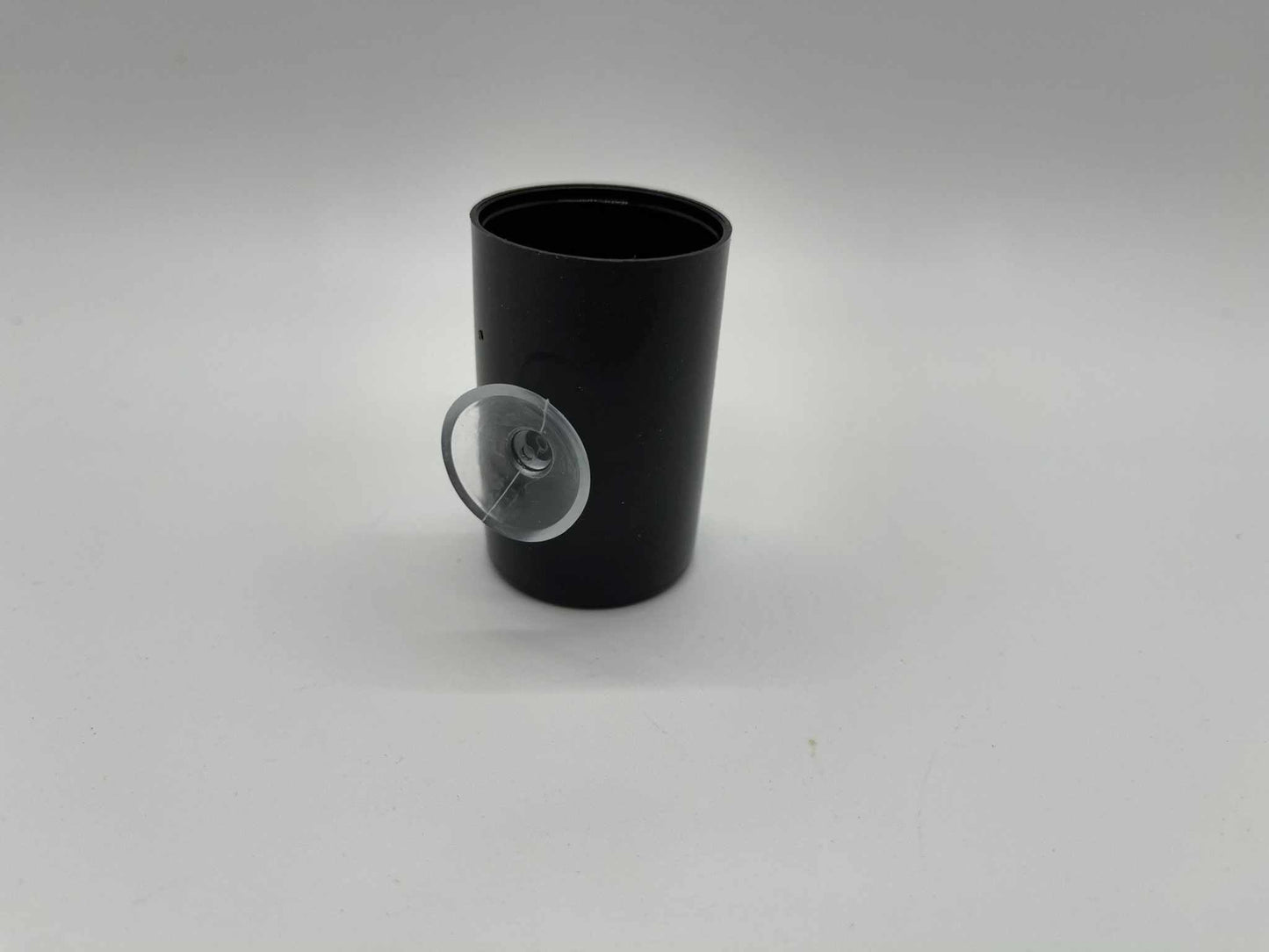 Black dart frog egg laying canister with clear suction cup attached